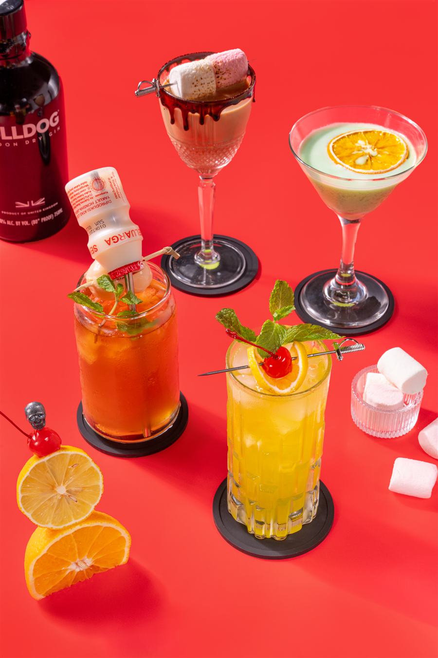 Chocolate ALTRS, ALTRS JKT and Slaychee cocktails styled together on a red backdrop