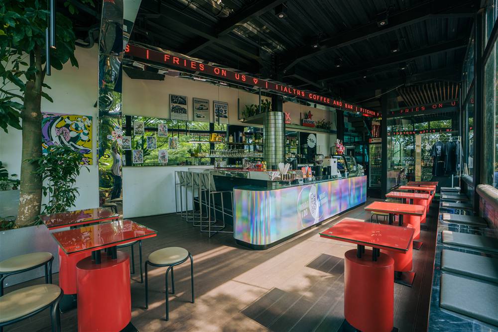 Red stools and tables along the ALTRS bar counter